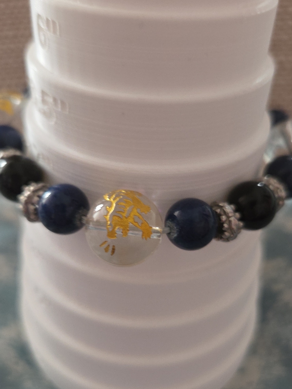 Clear Bead Gold Dragon Stretch Bracelet with Silver Accents and Blue Gem Beads